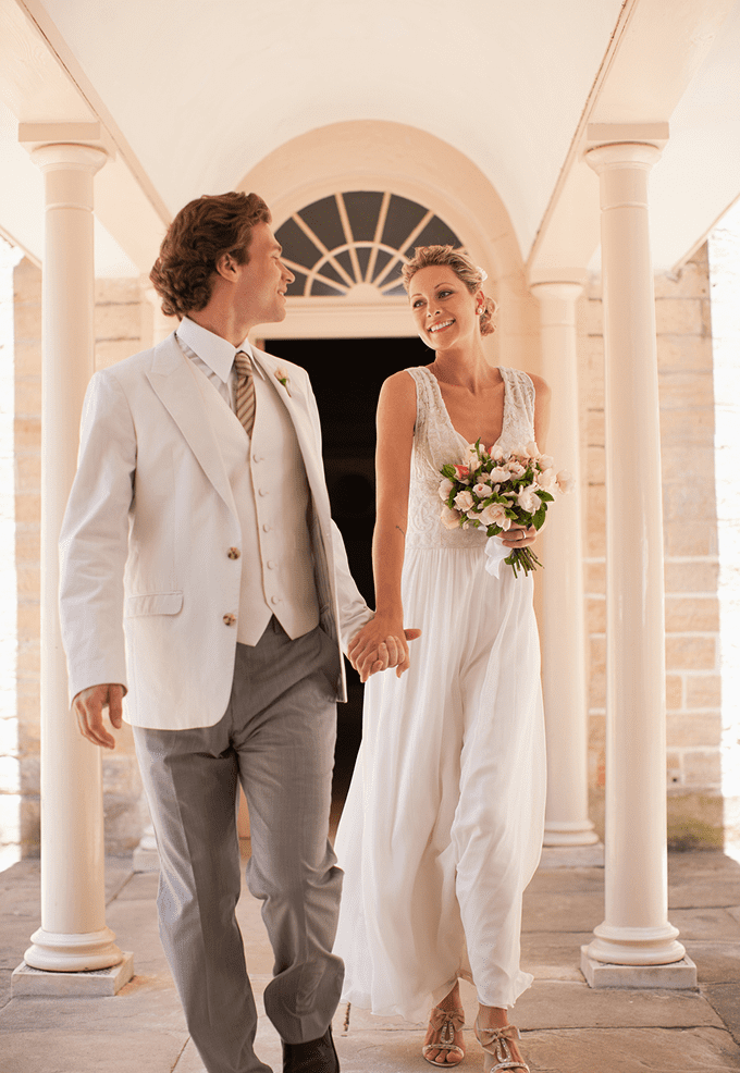 Bride and groom walking hand in hand