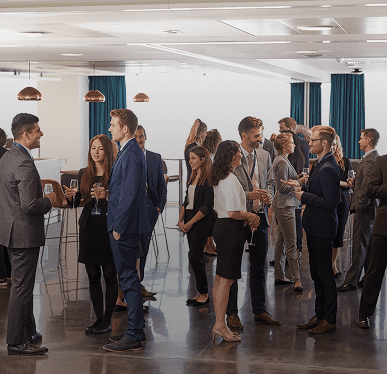 Business professionals networking at a conference